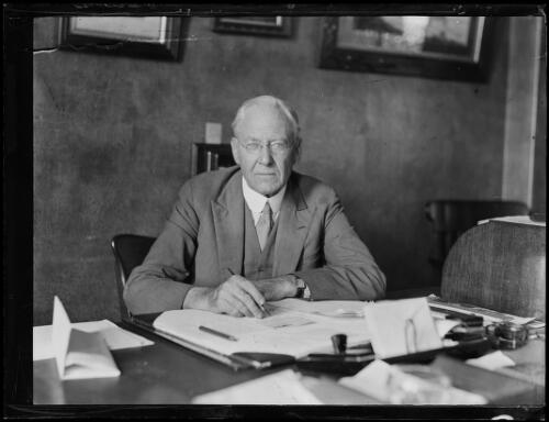 Mr Felix Booth sitting at his desk, New South Wales, 19 February 1932, 1 [picture]