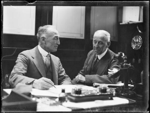 Mr A. McTavish, Manager of the Government Savings Bank at his desk with another man, New South Wales, 1931 [picture]