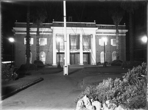 [Manly Municipal Council building at night, with flagpole] [picture] : [Sydney, New South Wales] / [Frank Hurley]
