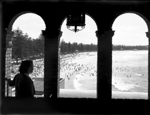 Manly through Arches [with figure in silhouette] [picture] : [Beaches, Sydney, New South Wales] / [Frank Hurley]