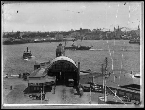 [Ferry leaving wharf and view from Milson's Point to Circular Quay, Metropole Hotel, tram shed, tram, Hurley's postcards, 367 Milson's Point Wharf, North Sydney, 1930's?] [picture] : [Sydney Harbour, New South Wales] / [Frank Hurley]