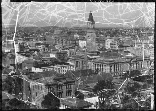 [Panorama of Brisbane, panel including Albert House, the City Hall, church, with mountains in the distance] [picture] : [Brisbane, Queensland] / [Frank Hurley]