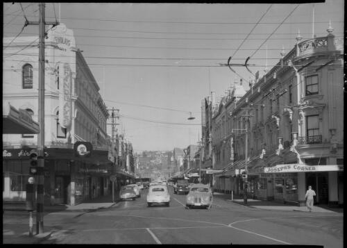 Brisbane Street, Launceston [Joseph's Corner, shops and cars] [picture] : [Launceston, Tasmania] / [Frank Hurley]