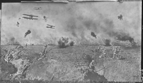 Most of a very large print of Over the Top, a composite shot of World War I battle in Ypres, signed "Frank Hurley 1917", propped against a house [picture] : [Flanders, World War I] / [Frank Hurley]