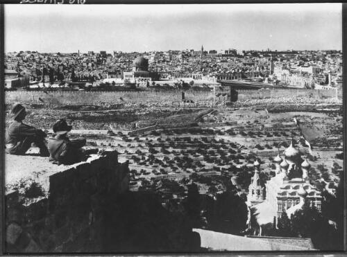 [Two men on a wall looking at the city of Jerusalem] [picture] / [Frank Hurley]