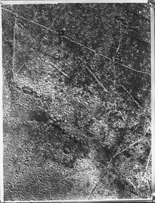 Section of Ypres Sector Battlefield showing intensity of shell craters aerial [taken from an observation balloon, inscribed with cross and '4B135 ca D26 bc-27ac 1412.17-2', 1917] [picture] : [Flanders, World War I] / [Frank Hurley]