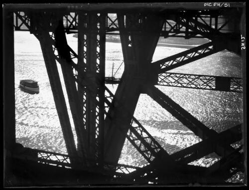 Under girders of bridge (glint on water) [picture] : [Sydney Harbour, New South Wales] / [Frank Hurley]