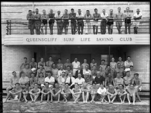 [Queenscliff Life Saving Club, men and boys, balcony, 1950s ] [picture] : [Beaches, Sydney, New South Wales] / [Frank Hurley]