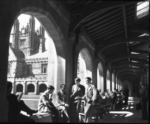University series, students in cloisters [Sydney University, 1940s] [picture] : [Sydney, New South Wales] / [Frank Hurley]