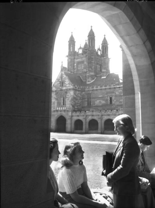 In cloisters, vertical [Sydney University, 1940s] [picture] : [Sydney, New South Wales] / [Frank Hurley]
