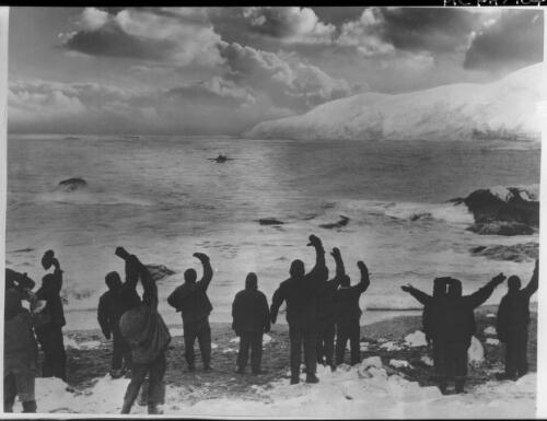 A boat was lowered for the shore, ringing cheers greeted its approach, a terrible chapter in our lives was drawing to a close [picture] : [Antarctica] / [Frank Hurley]