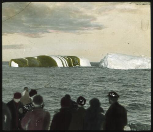 [Ten men and two icebergs, one darkly striped, Banzare, 1929-1931] [picture] : [Antarctica] / [Frank Hurley]