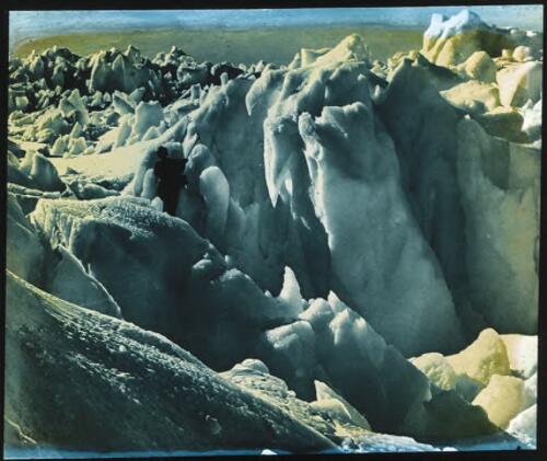 As we descended, the ice grew into a maze of crevasses with yawning abysses on every side - it was impassable [Adelie Land, Australasian Antarctic Expedition, 1911-1914] [picture] : [Antarctica] / [Frank Hurley]