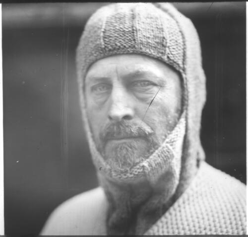[Portrait of Sir Douglas Mawson wearing a knitted woollen balaclava and jumper] [picture] : [Antarctica] / [Frank Hurley]