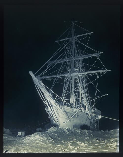 The long, long night [the Endurance in the Antarctic winter darkness, trapped in the Weddell Sea, Shackleton expedition, 27 August 1915] [picture] : [Antarctica] / [Frank Hurley]