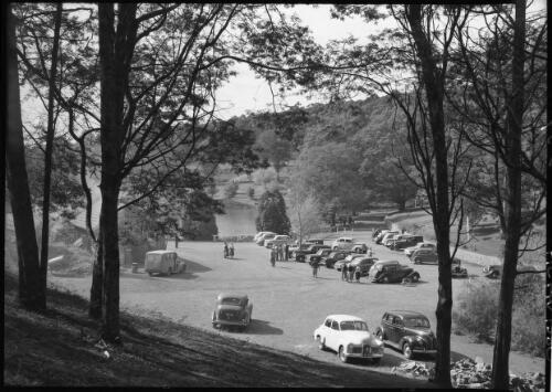 Emerald Lake [car park, trees, figures] [picture] : [Victoria] / [Frank Hurley]