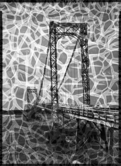 The suspension bridge which links San Remo to New Haven on Philip Island [Victoria] [picture] : [Victoria] / [Frank Hurley]