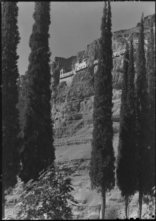 Greek Convent on the Mount of the Quarantine, near Jericho, Jordan valley 20th Dec 42 [viewed through trees, 20 December 1942] [picture] / [Frank Hurley]