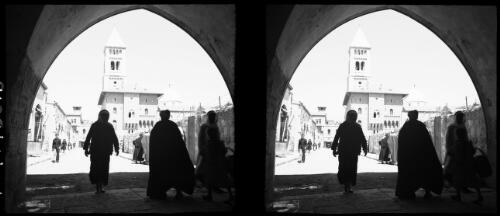 In Jerusalem Church of Redeemer [with figures walking through an archway] [picture] / [Frank Hurley]