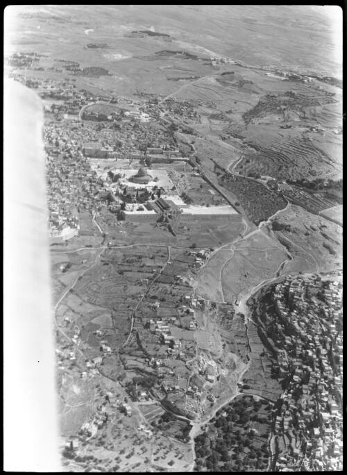 Temple area, Jerusalem, from above Kedron valley [with part of aircraft wing] [picture] / [Frank Hurley]
