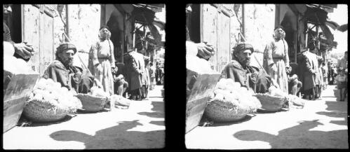 Jerusalem [street scene with stalls and a basket of oranges] [picture] / [Frank Hurley]