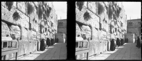Wailing Wall [with figures and a table, Jerusalem] [picture] / [Frank Hurley]