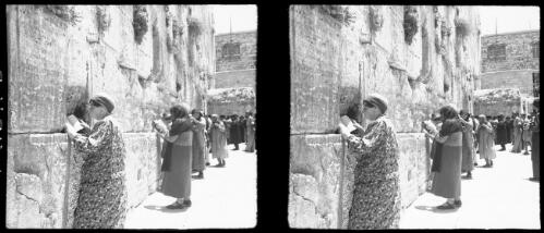 Wailing Wall [and figures with books, Jerusalem] [picture] / [Frank Hurley]