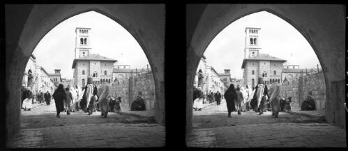 Church of Redeemers, Jerusalem [view through archway, figures, ca. 1940-1945] [picture] / [Frank Hurley]