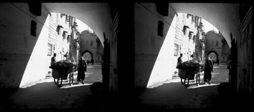 Jerusalem [walking through a half-archway, ca. 1940-1945] [picture] / [Frank Hurley]