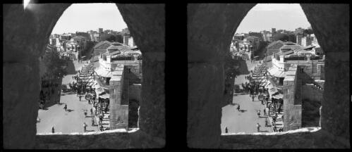 Jerusalem [view down on a street taken through an arched stone window, ca. 1940-1945] [picture] / [Frank Hurley]