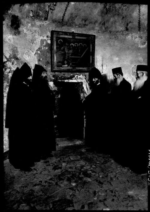 [A group of religious men wearing capes assembled in the Chapel of the Finding of the Cross] [picture] / [Frank Hurley]