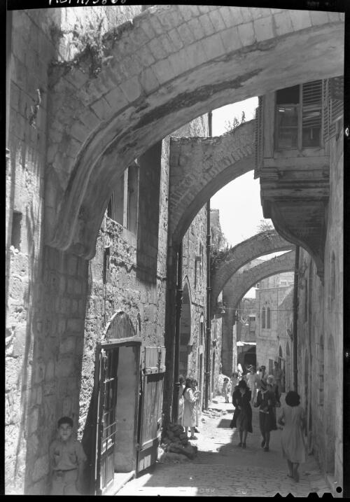 Via Dolorosa Jerusalem [the span of the Via Dolorosa between the fifth and sixth stations of the Way of the Cross] [picture] / [Frank Hurley]