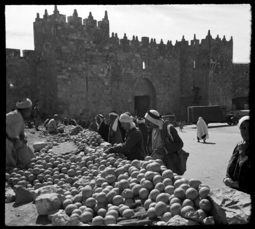 Street scenes in Jerusalem [selling fruit in the outdoor market] [picture] / [Frank Hurley]