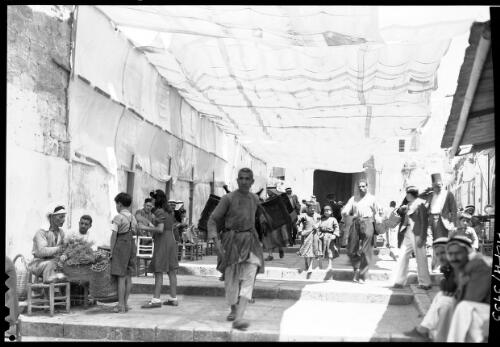[Street scene Old Jerusalem showing a crowded market scene in a wide, stepped walkway near the Damascus Gate] [picture] / [Frank Hurley]