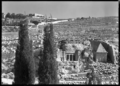Jewish graves of slopes of Mount of Olives Jerusalem [1, rightmost building with the pyramid roof is the Tomb of Zacharia and the other to the left is the Grotto of St James] [picture] / [Frank Hurley]