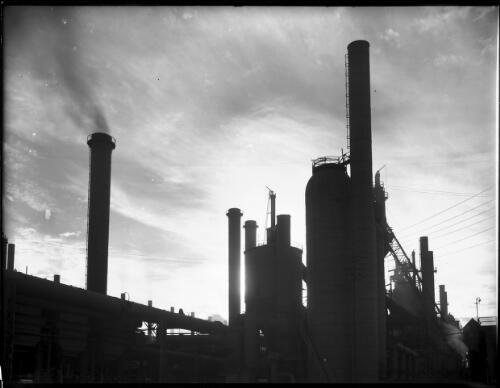 [Towers, pipes, electrical wires, chimneys and ladders, B.H.P. Steelworks] [picture] : [Newcastle, New South Wales] / [Frank Hurley]