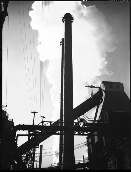 B.H.P. Steelworks, steam from the coke quenching tower at the coke ovens department [picture] : [Newcastle, New South Wales] / [Frank Hurley]