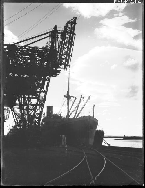 [B.H.P. Steelworks' S.S. Iron Prince at the ore discharging wharf] [picture] : [Newcastle, New South Wales] / [Frank Hurley]