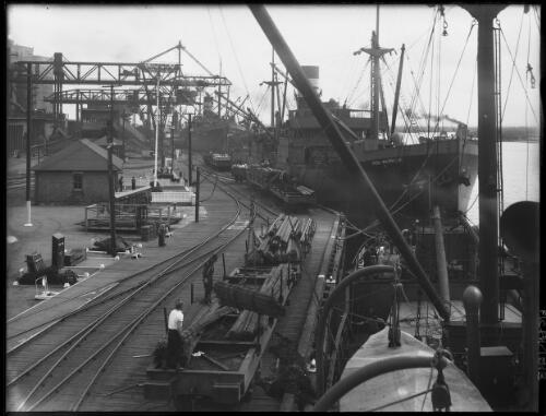 Loading steel at B.H.P. Wharf [picture] : [Newcastle, New South Wales] / [Frank Hurley]