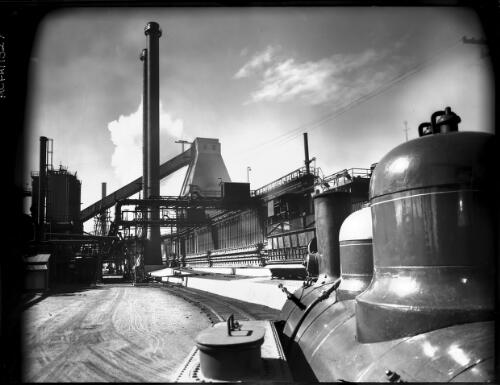 [Railway tracks and storage vessels, B.H.P. steelworks] [picture] : [Newcastle, New South Wales] / [Frank Hurley]