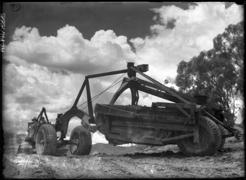 Tractor and Le Torneau Carryall at Mt. Beauty Terminal Site [with men, Kiewa, December 1947] [picture] : [State Electricity Commission of Victoria] / [Frank Hurley]