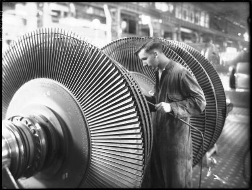 Turbine Blacking [with figure, power station, Yallourn, Victoria, December 1947] [picture] : [State Electricity Commission of Victoria] / [Frank Hurley]