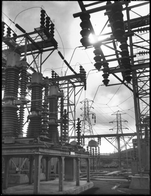 Silhouette study leading out Gantries & P.S., leading out cables from switch yard [Power Station, Yallourn, Victoria, December 1947] [picture] : [State Electricity Commission of Victoria] / [Frank Hurley]