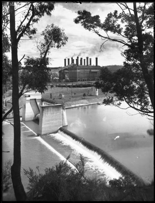 Power House across the Latrobe R. [Latrobe River, vertical, power station, Yallourn, Victoria, December 1947] [picture] : [State Electricity Commission of Victoria] / [Frank Hurley]