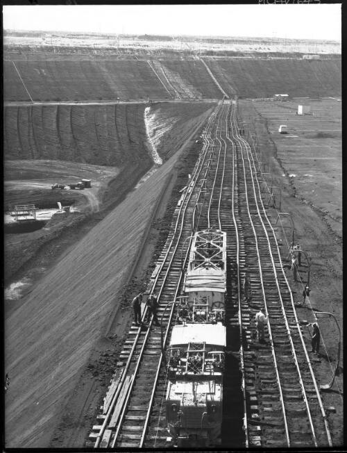 Track shifters[?] high angle [open cut coal mine, Yallourn, Victoria, December 1947] [picture] : [State Electricity Commission of Victoria] / [Frank Hurley]
