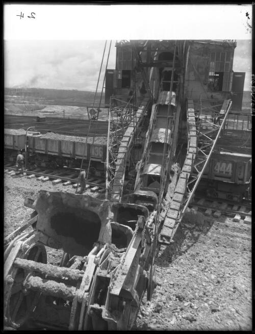 Overburden dredge [from above, open cut coal mine, Yallourn, Victoria, December 1947] [picture] : [State Electricity Commission of Victoria] / [Frank Hurley]