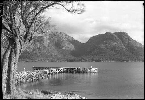 The Hazards from jetty [hills and water with a tree on the left] [picture] : [Coles Bay, Tasmania] / [Frank Hurley]