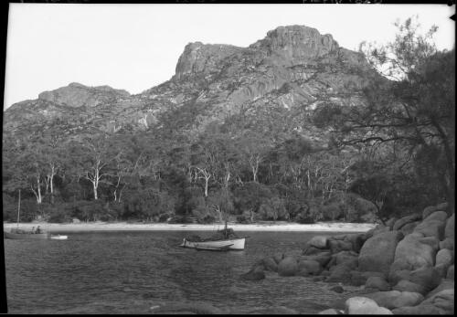 The Fisheries, Coles Bay [with three boats] [picture] : [Coles Bay, Tasmania] / [Frank Hurley]
