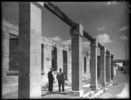 Ruins of Commandant's Offices [with figures] [picture] : [Port Arthur, Tasmania] / [Frank Hurley]