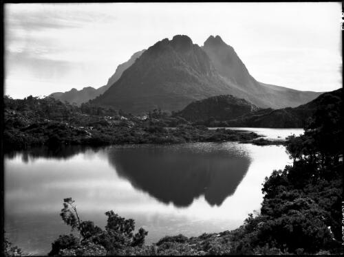 Cradle Mt reflected in Twisted Lake [horizontal] [picture] : [Cradle Mountain, Tasmania] / [Frank Hurley]